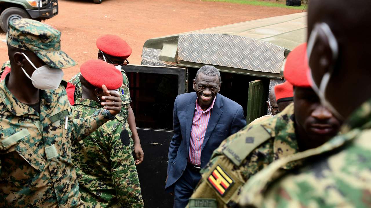 Ugandan four-time presidential aspirant Kizza Besigye arrives at Uganda Military General Court Martial in Kampala
