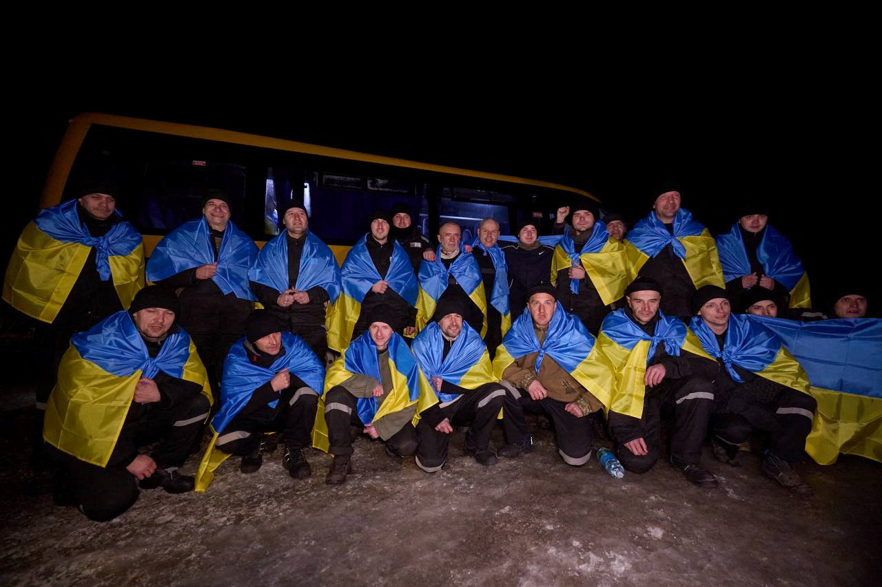Ukrainian POWs pose for a picture after a swap at an unknown location in Ukraine