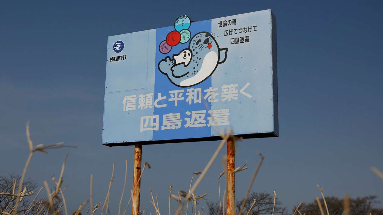 FILE PHOTO: A message board reads messages demanding for the return of a group of islands, called Northern Territories by Japan and Southern Kuriles by Russia, is displayed in Nemuro