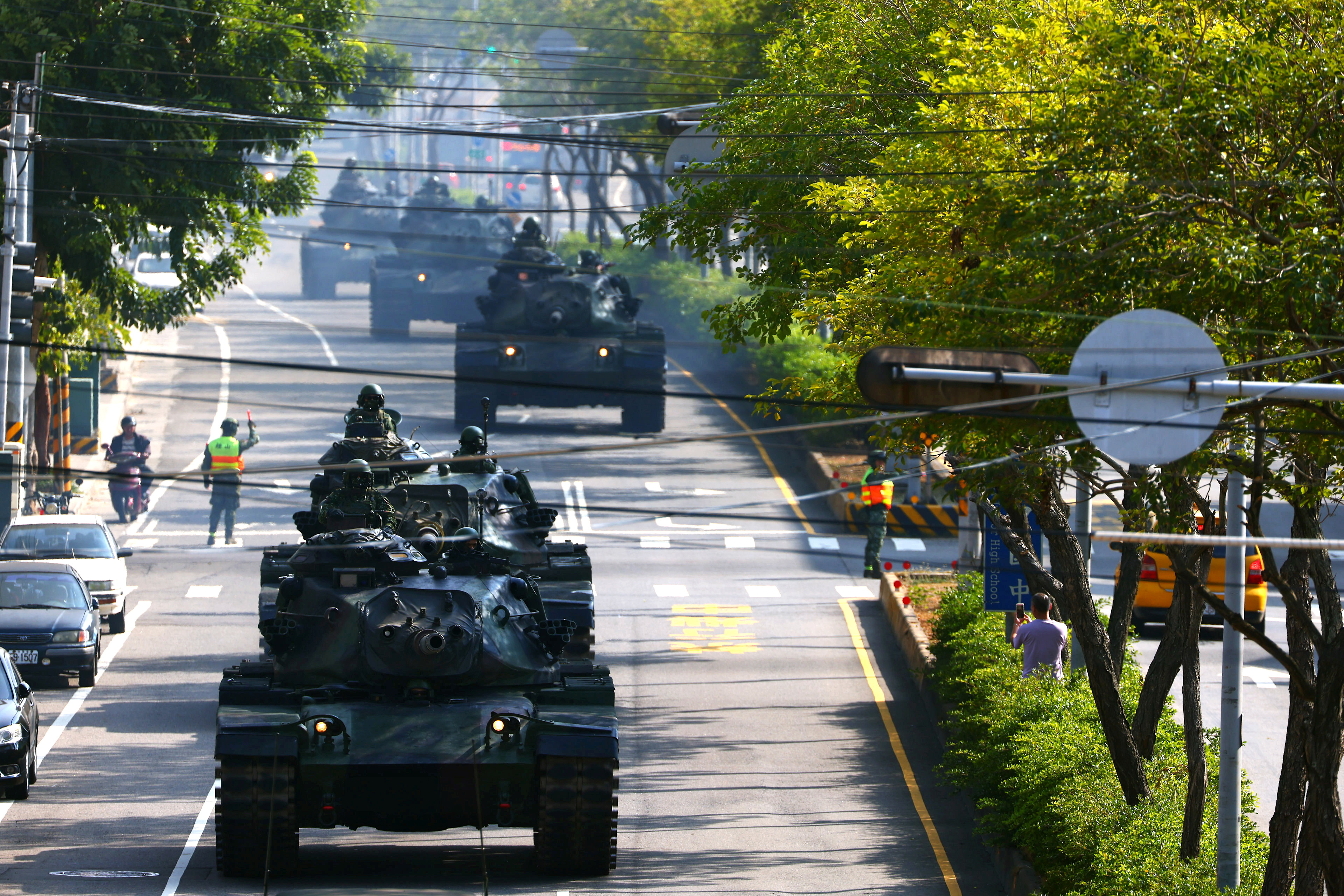 FILE PHOTO: Soldiers drive M60 tanks on a street as part of a military drill in Taichung