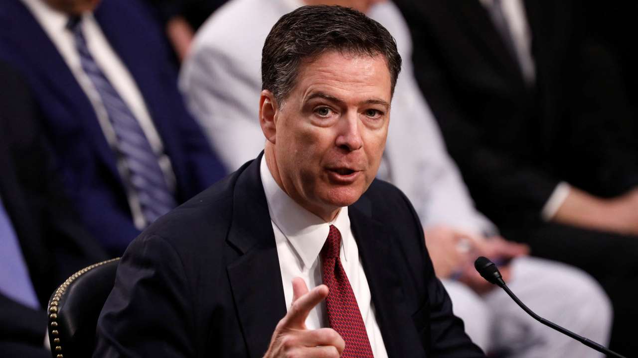 FILE PHOTO: Former FBI Director Comey testifies before a Senate Intelligence Committee hearing in Washington
