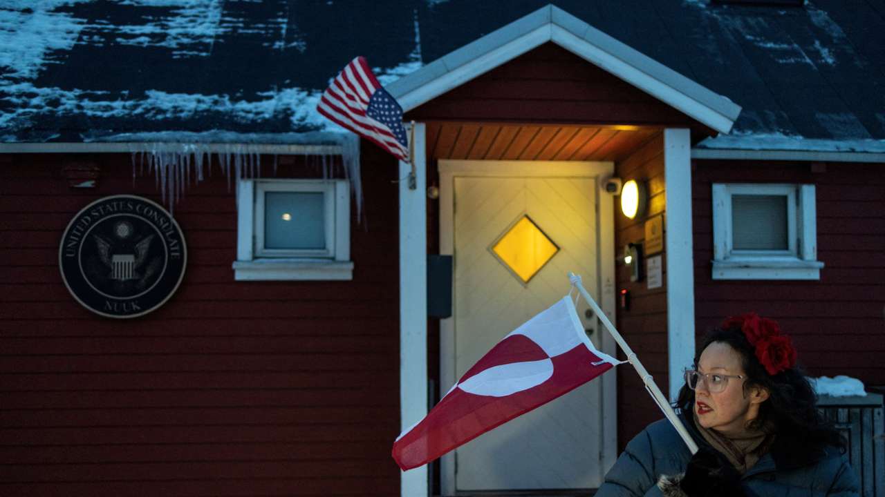 People protest in front of the U.S. consulate in Nuuk