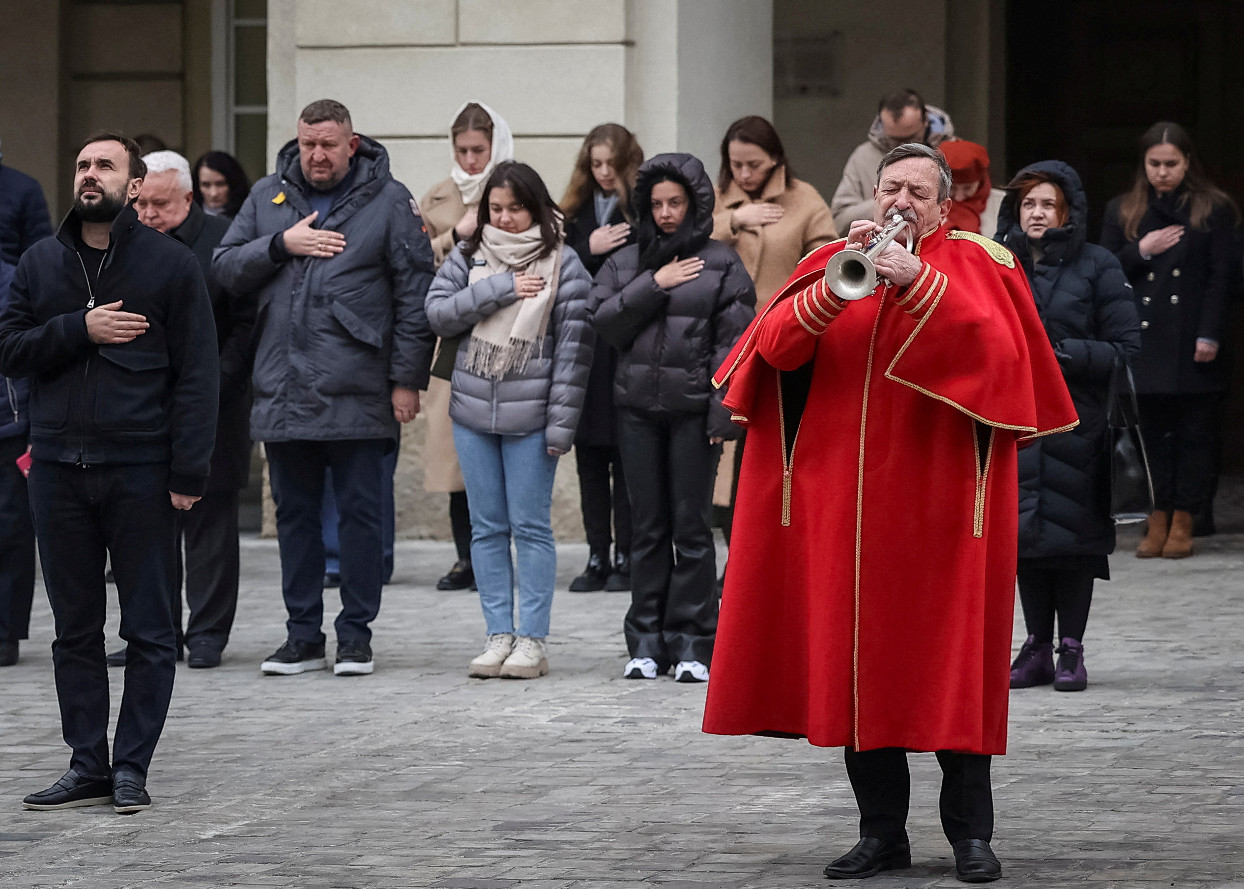 A trumpeter Simkiv plays his trumpet during a funeral ceremony for Ukrainian serviceman who was killed in a fight against Russian troops in Lviv