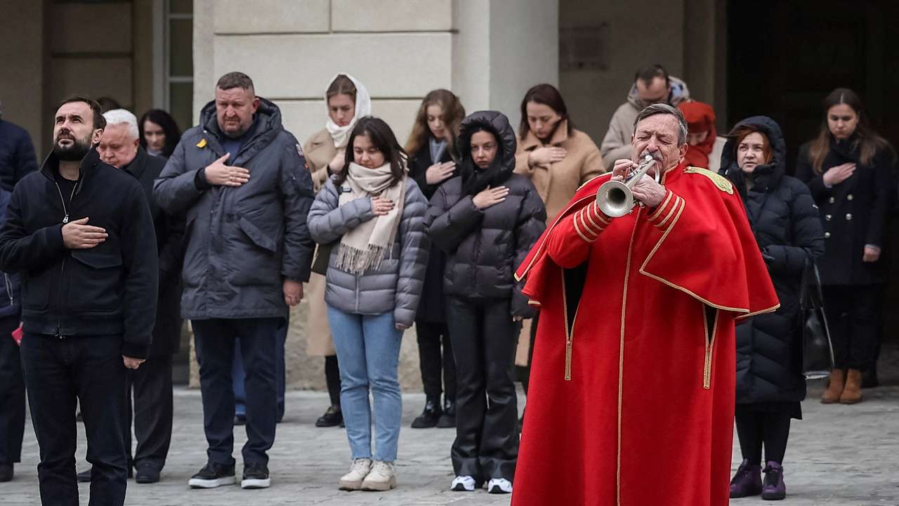 A trumpeter Simkiv plays his trumpet during a funeral ceremony for Ukrainian serviceman who was killed in a fight against Russian troops in Lviv