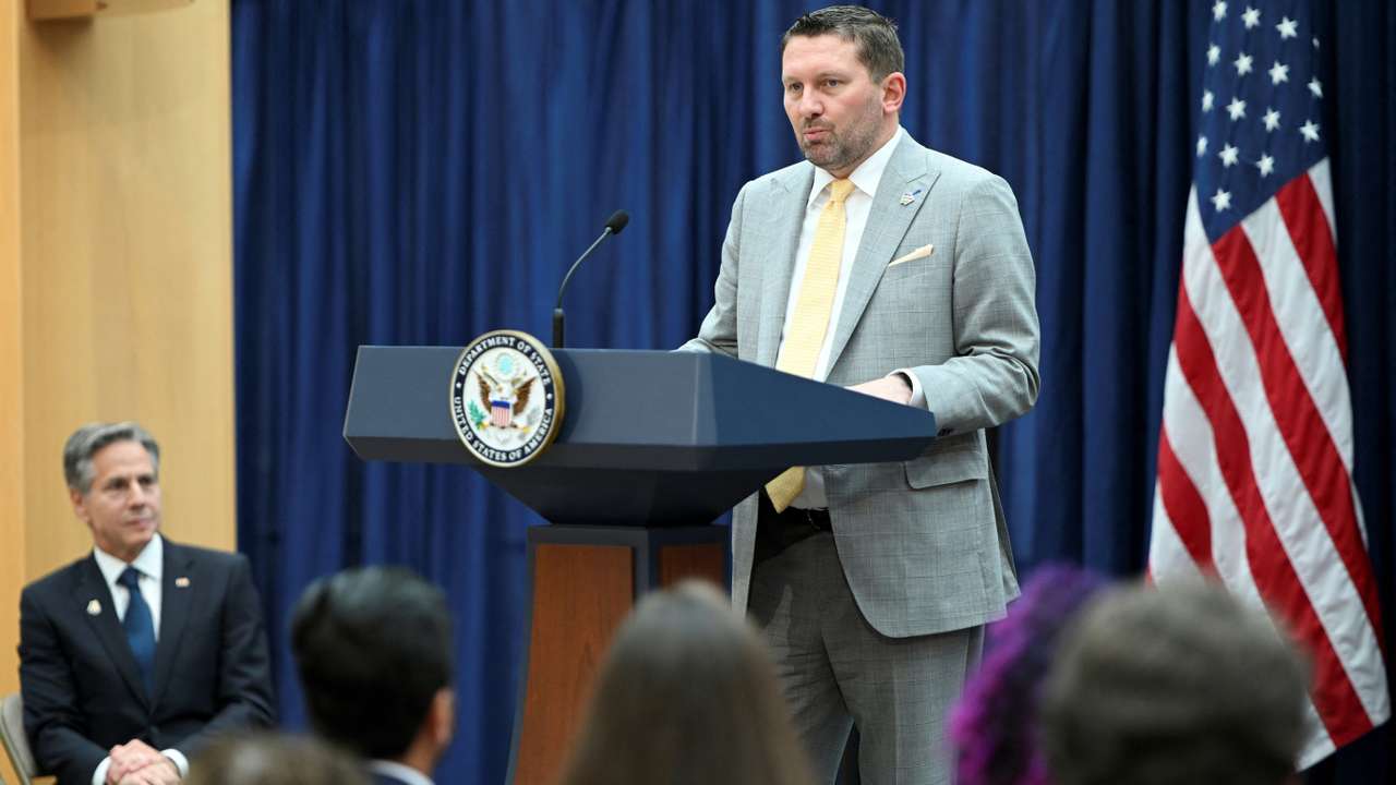 U.S. Secretary of State Antony Blinken looks on as AfghanEvac founder Shawn VanDiver speaks during a Memorandum of Understanding signing in Washington