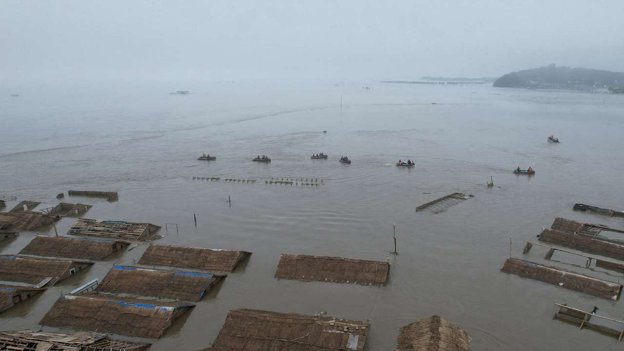 North Korean leader Kim Jong Un visits a flood-affected area near the border with China, in North Pyongan Province