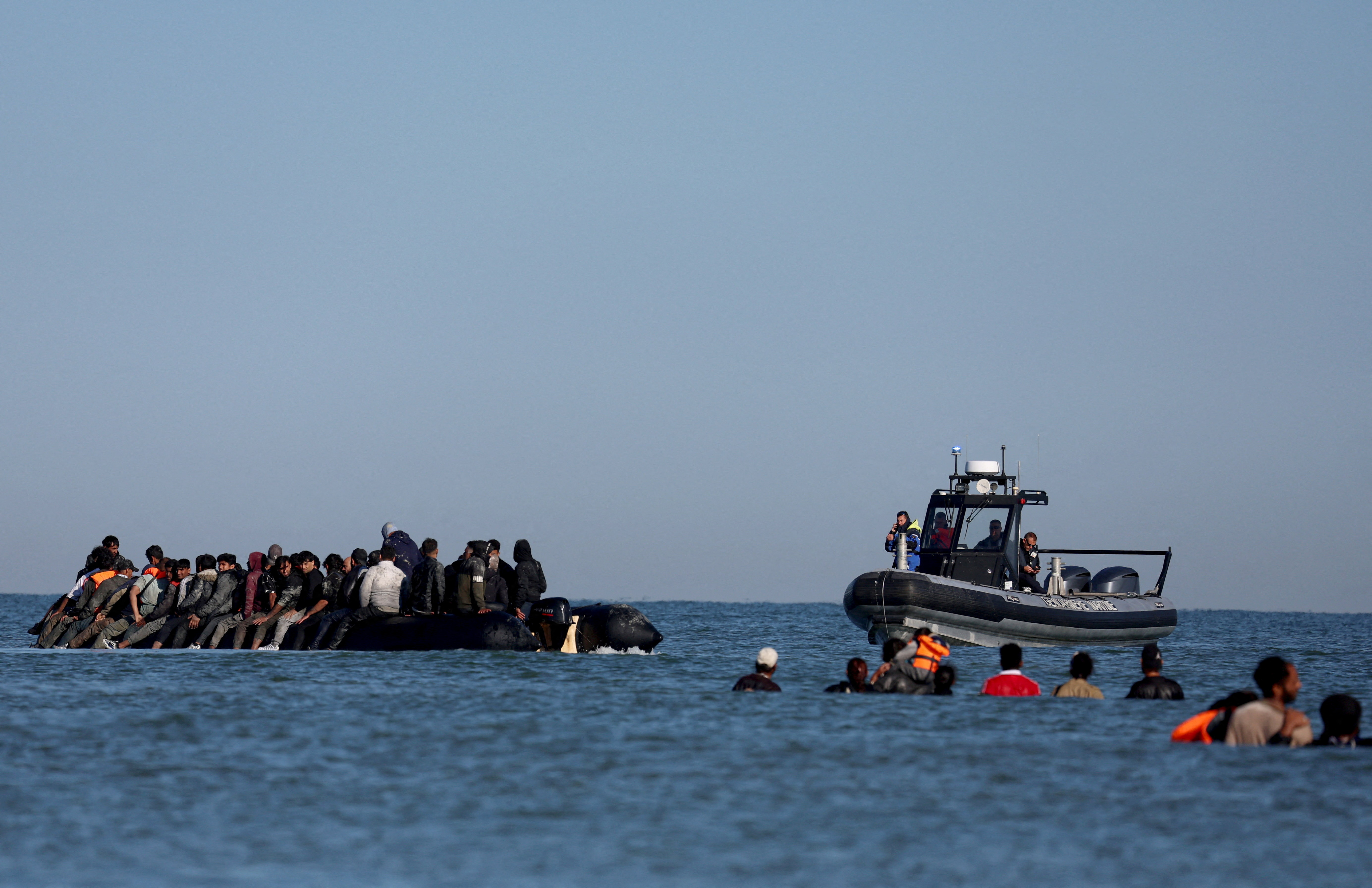 FILE PHOTO: Migrants attempt to cross the English channel from northern France