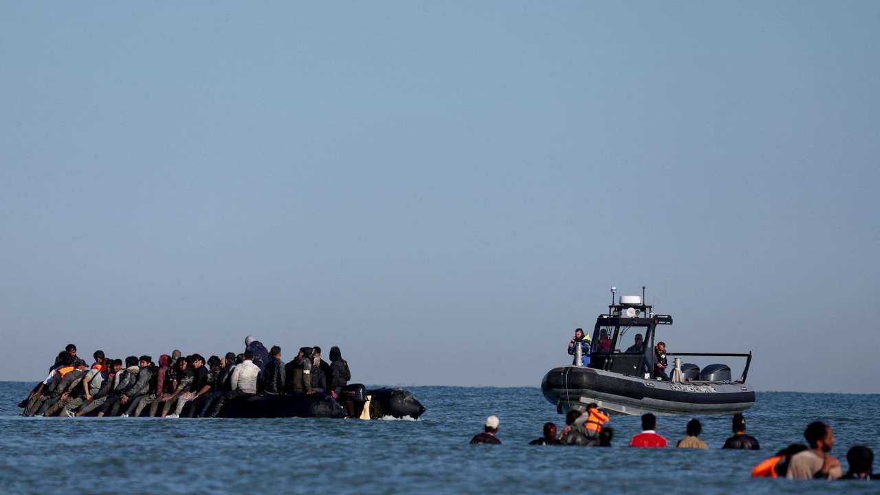 FILE PHOTO: Migrants attempt to cross the English channel from northern France