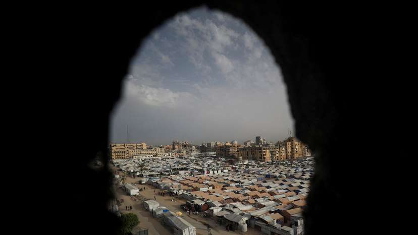 Palestinians displaced by the Israeli military offensive take shelter in tents, in Gaza