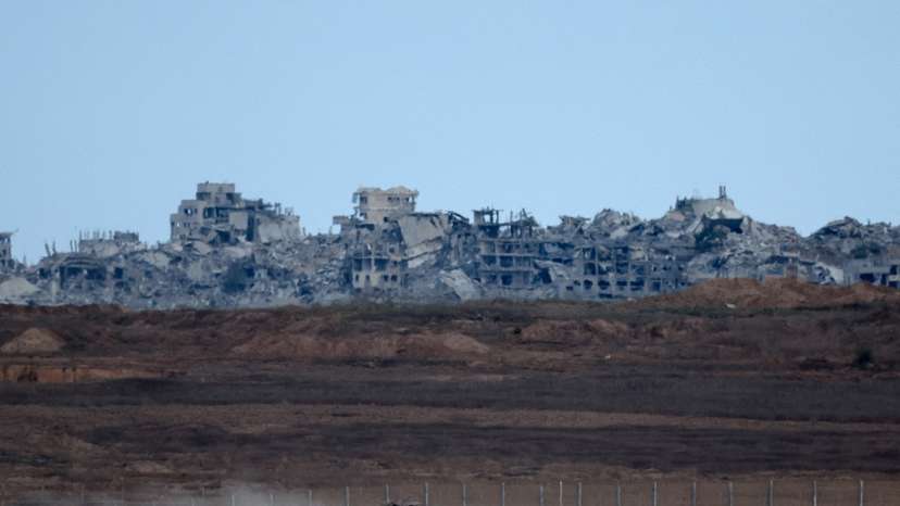 Truck transports Israeli APC in Israel near the border with Gaza