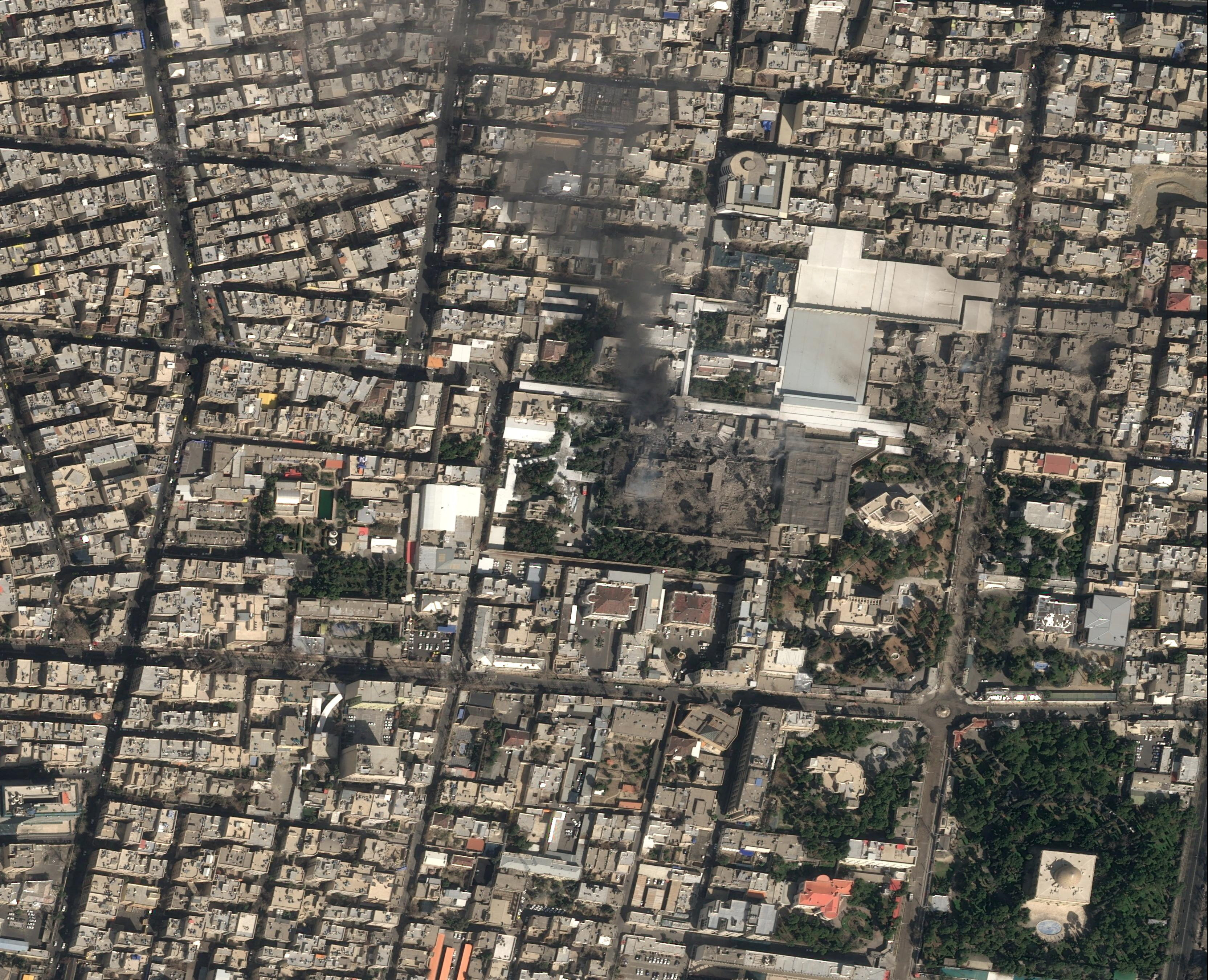 A satellite image shows black smoke rising and heavy damage at Iranian Supreme Leader Ayatollah Ali Khamenei's compound in Tehran