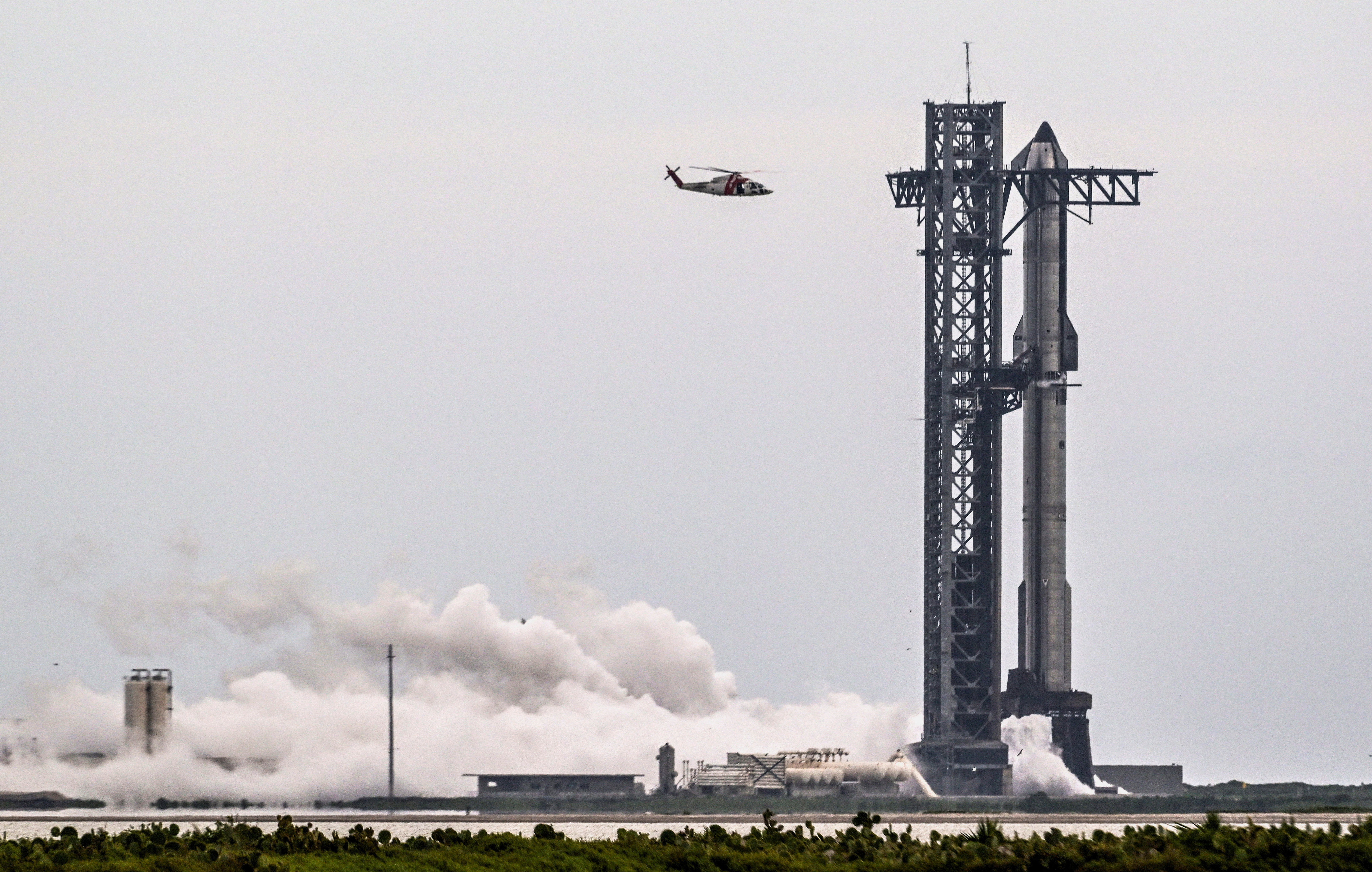 A SpaceX Starship spacecraft stands on the launch pad after the launch was scrubbed due to weather concerns