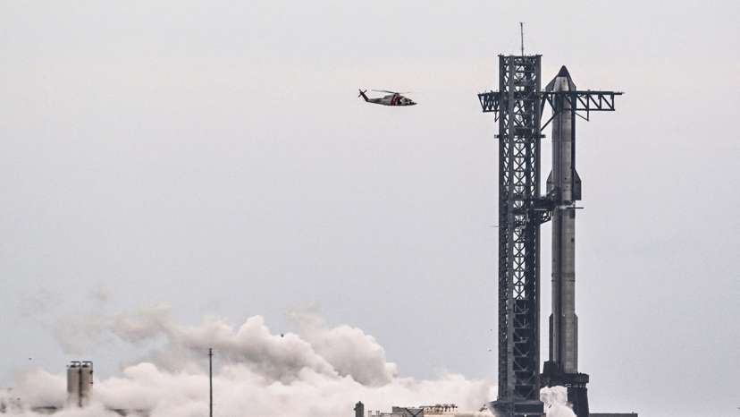 A SpaceX Starship spacecraft stands on the launch pad after the launch was scrubbed due to weather concerns