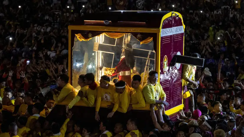 Filipino Catholic devotees parade "Black Nazarene" in celebration of Christ