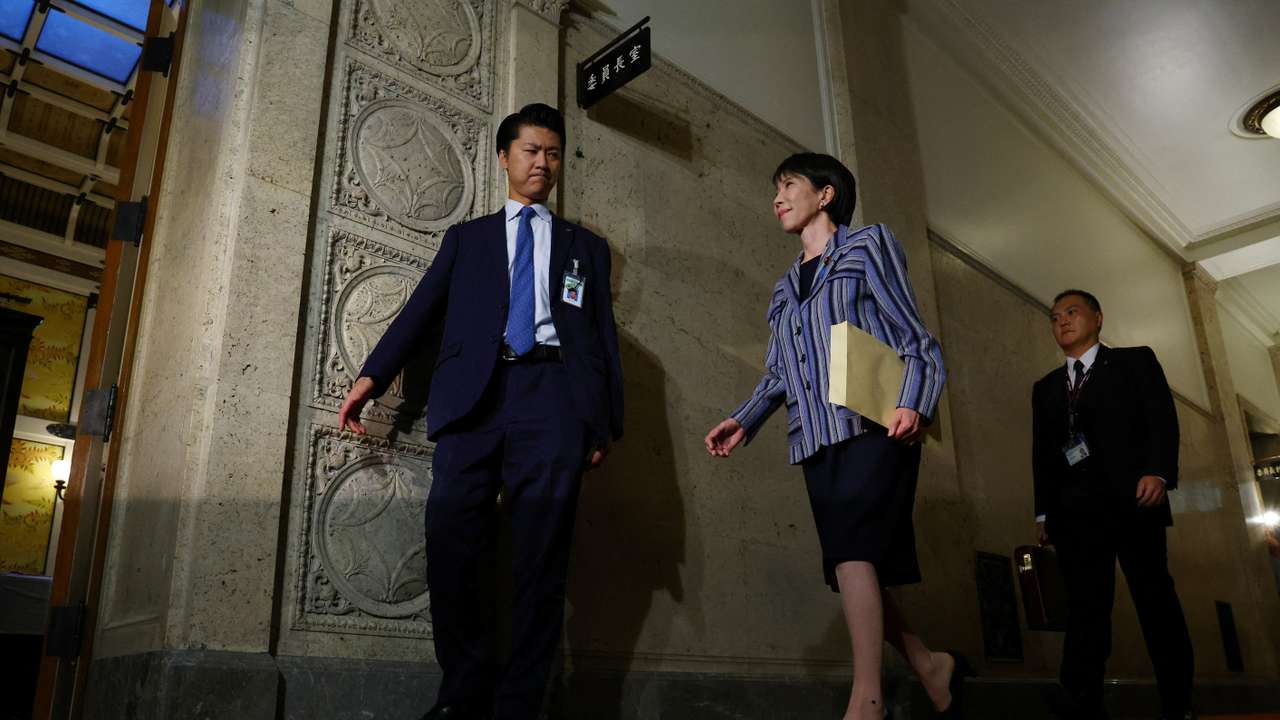 Leader of Japan's ruling Liberal Democratic Party (LDP) Sanae Takaichi enters a room to meet Japan Innovation Party's co-leader Fumitake Fujita at Japan's National Diet Building, in Tokyo
