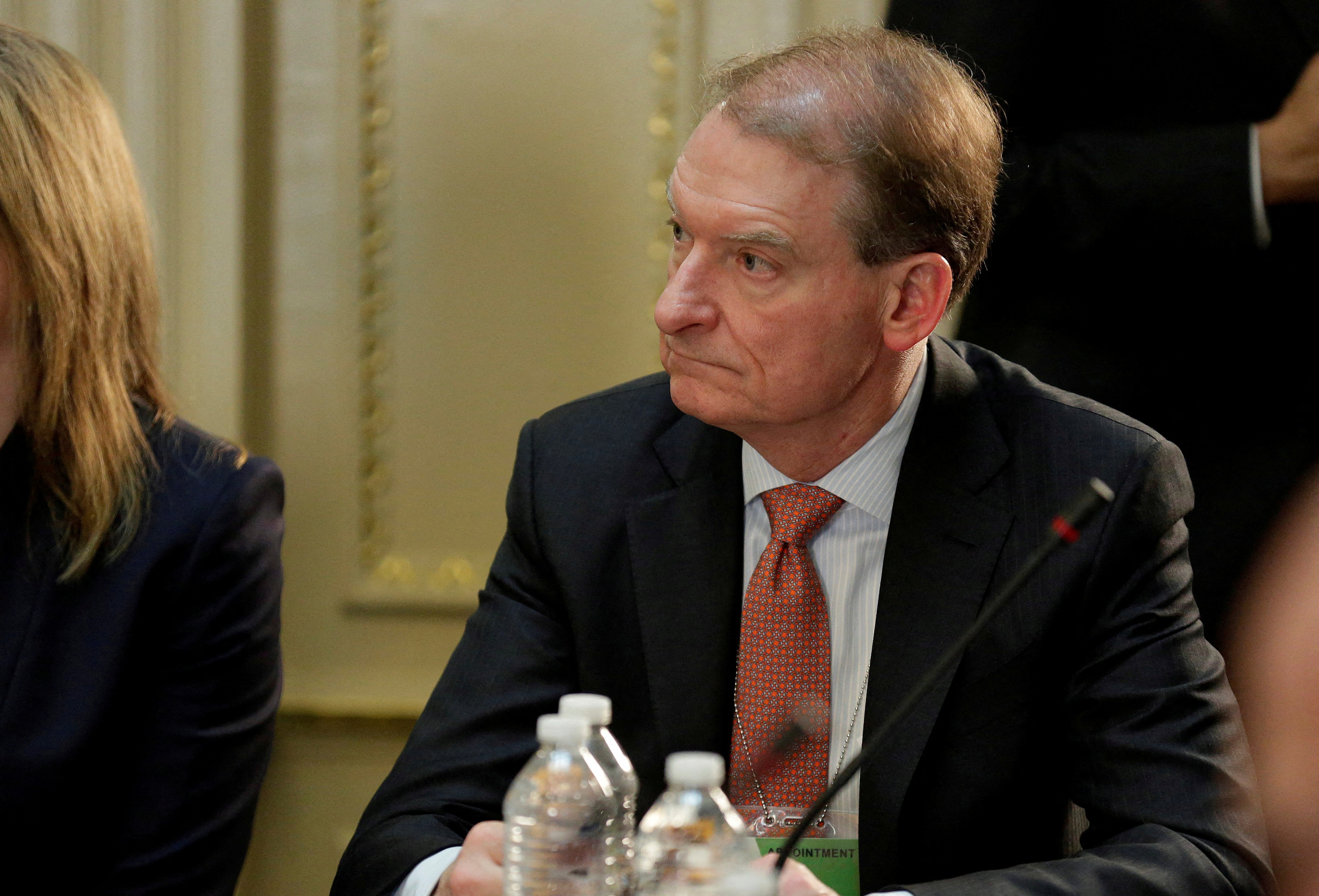 FILE PHOTO: CEO of Patomak Global Partners LLC Paul Atkins takes part in a strategic and policy CEO discussion with U.S. President Donald Trump in the Eisenhower Execution Office Building in Washington