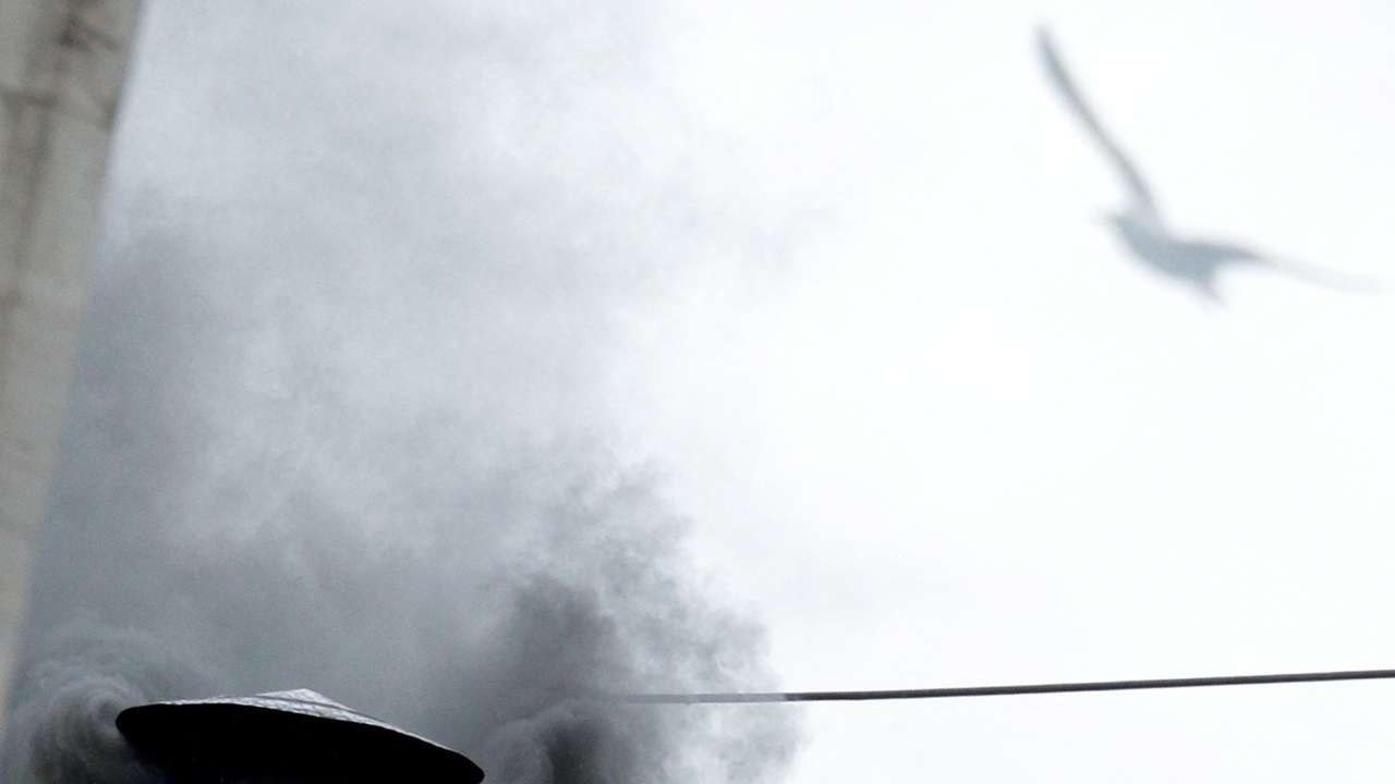 FILE PHOTO: Black smoke rises from the chimney on the Sistine Chapel in Saint Peter's Square at the Vatican