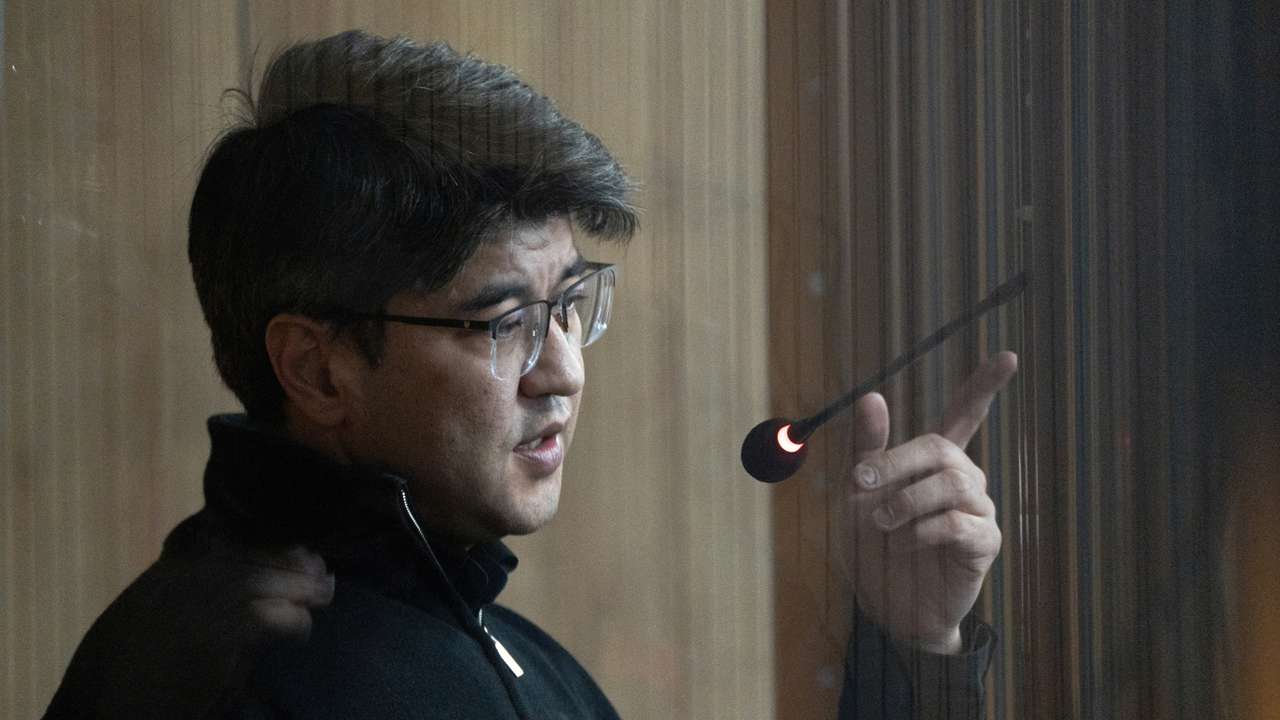 Kazakhstan's former Economy Minister Kuandyk Bishimbayev attends a court hearing in Astana
