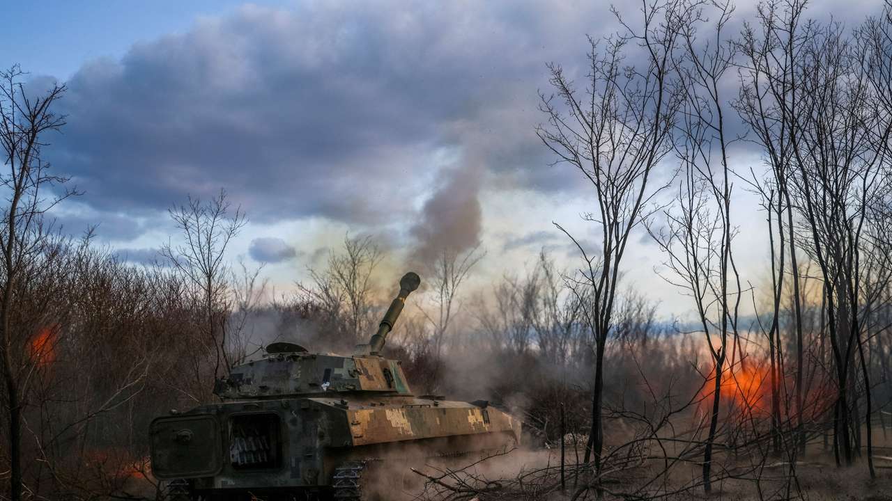 FILE PHOTO: Ukrainian servicemen fires a self-propelled howitzer towards Russian troops in a front line in Kherson region
