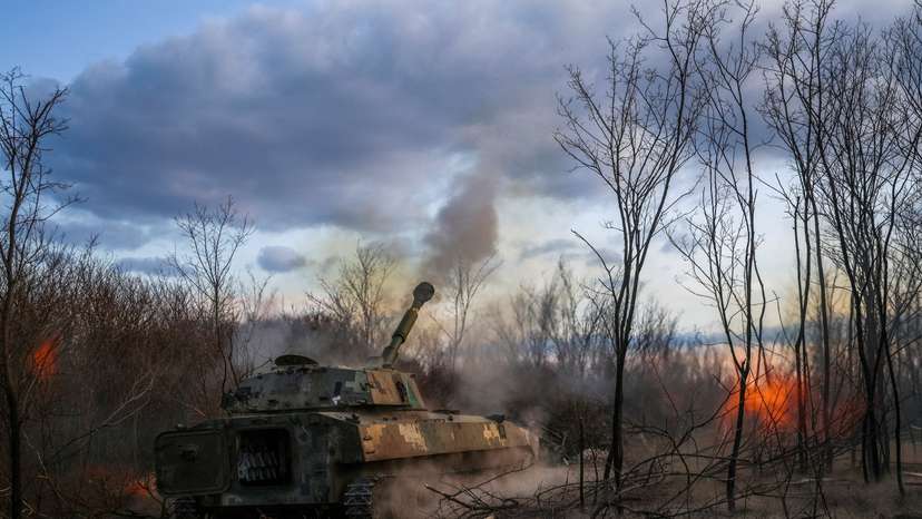 FILE PHOTO: Ukrainian servicemen fires a self-propelled howitzer towards Russian troops in a front line in Kherson region