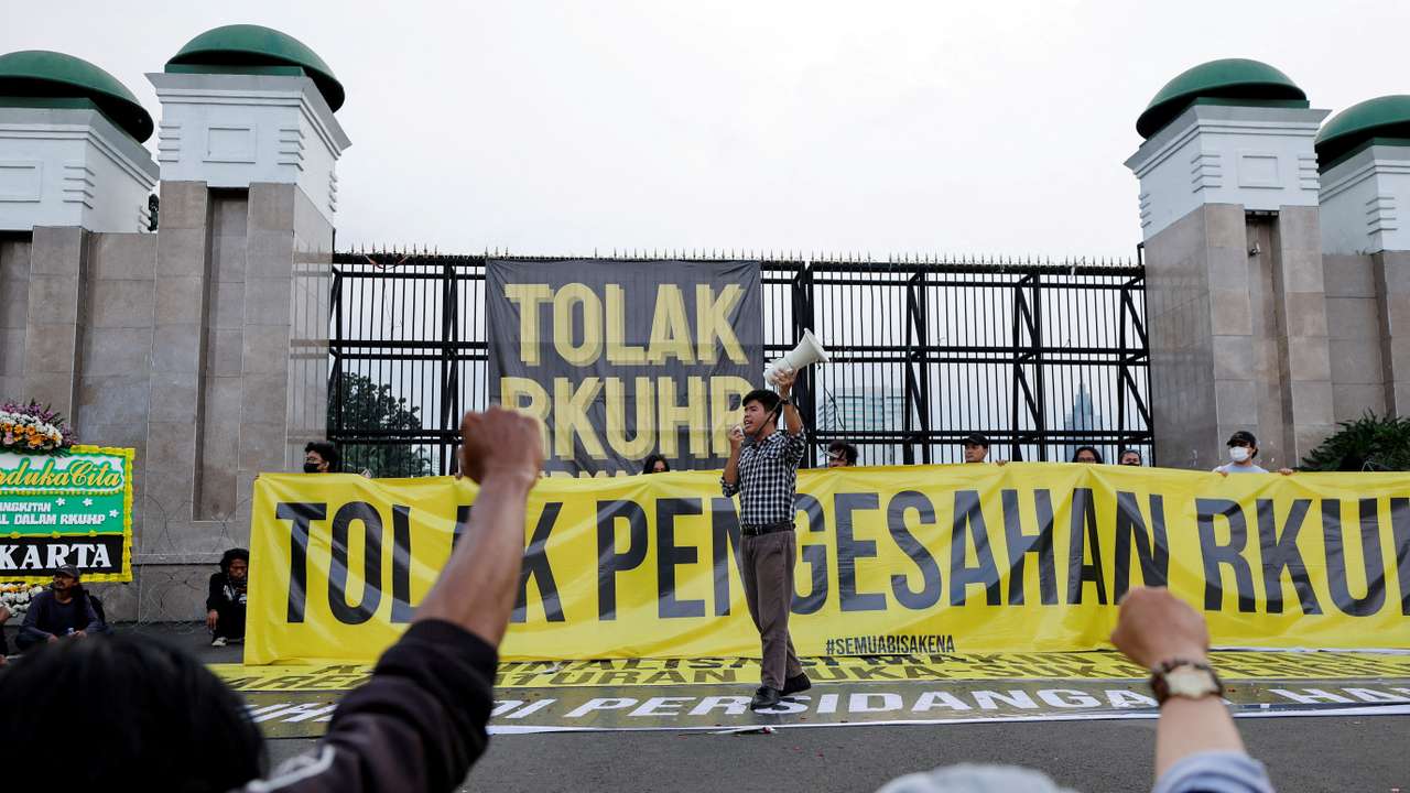 FILE PHOTO: People protest against a new criminal code in Jakarta
