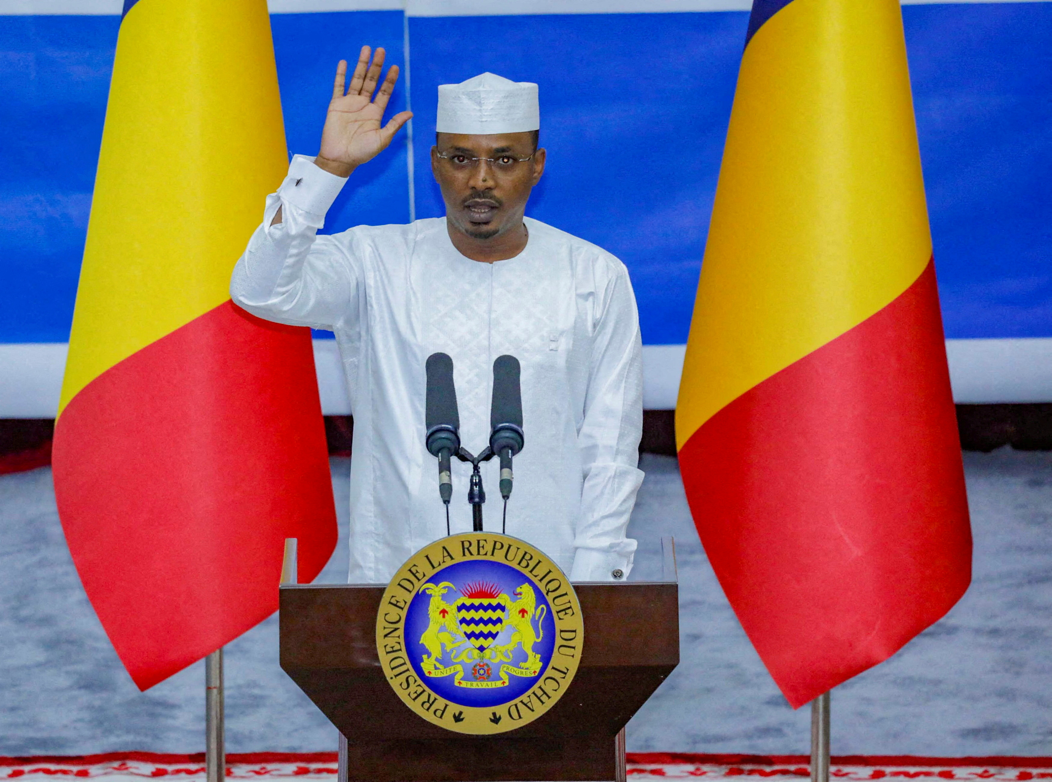 FILE PHOTO: Chad President Mahamat Idriss Deby raises his hand during his inauguration ceremony