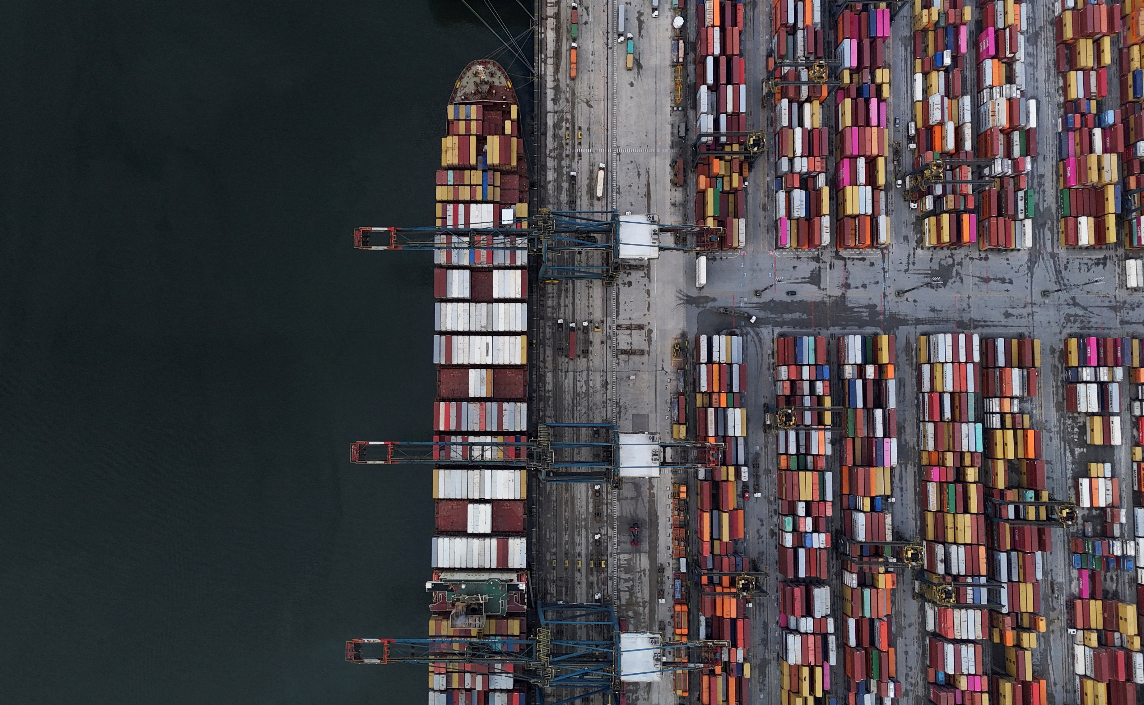 FILE PHOTO: A drone view shows a ship and containers at the Port of Santos, in Santos