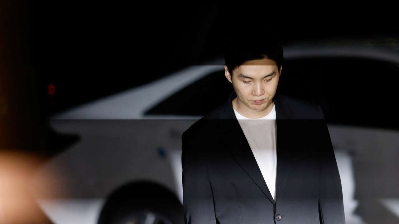 Suga of the K-pop boy band BTS arrives at a police station for questioning regarding his drunk driving charge, in Seoul