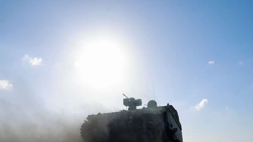A military vehicle maneuvers near the Israel-Gaza border, in Israel