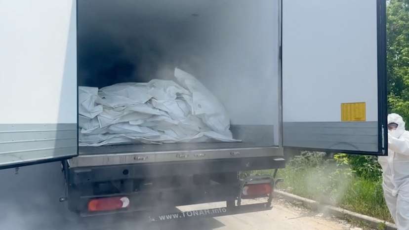 A still image from a video released by Russia's Defence Ministry shows what it said to be lorries with bodies of Ukrainian service members to be handed over to Ukraine, at an unidentified location