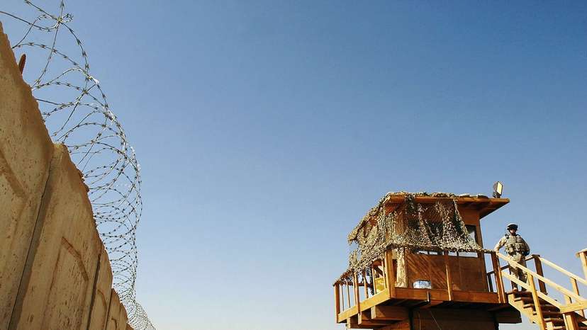 A US soldier stands guard at Abu Ghraib prison west of Baghdad