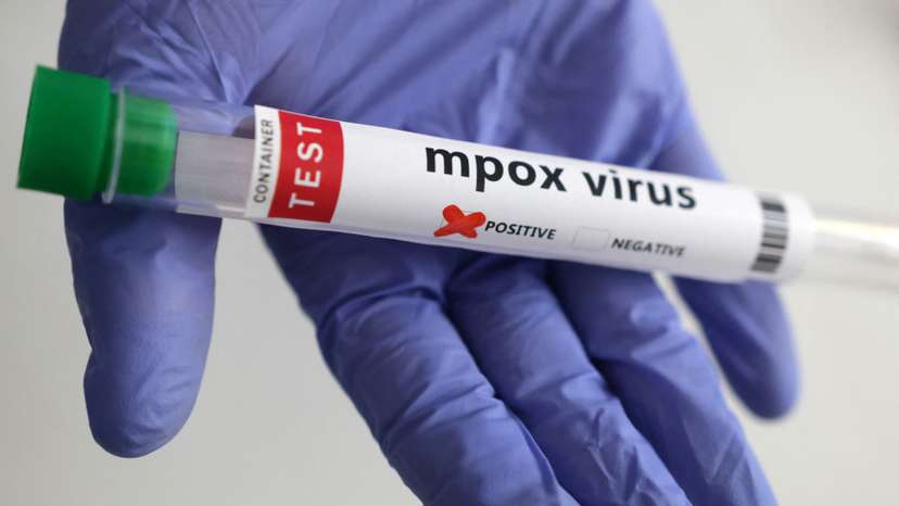 Illustration shows test tubes with "Mpox virus positive" label