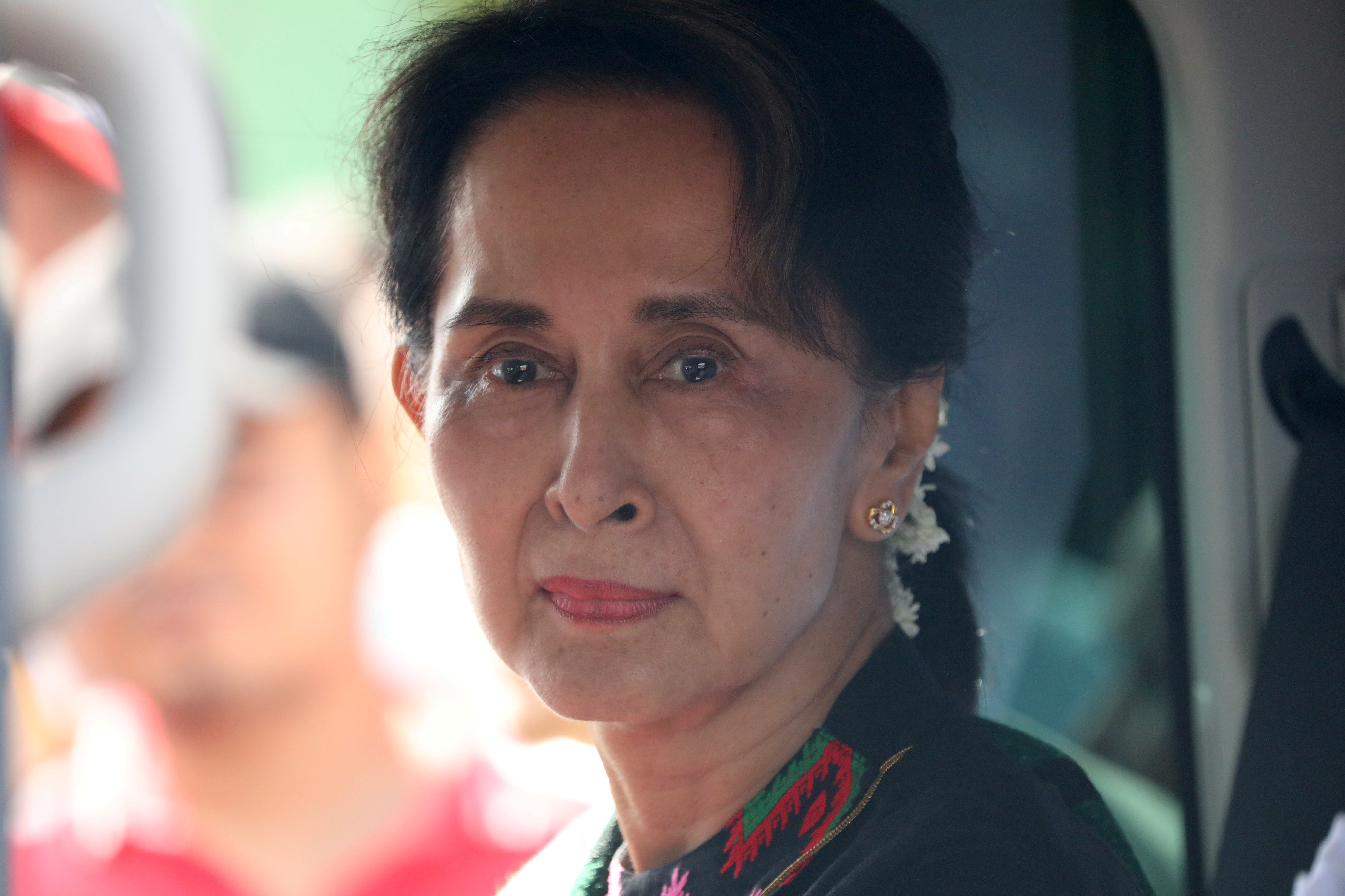 Myanmar's State Counsellor Aung San Suu Kyi arrives at a school in Kawhmu