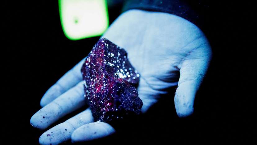 FILE PHOTO: Tungsten is illuminated with mineral light in a mine in Gangwon Province
