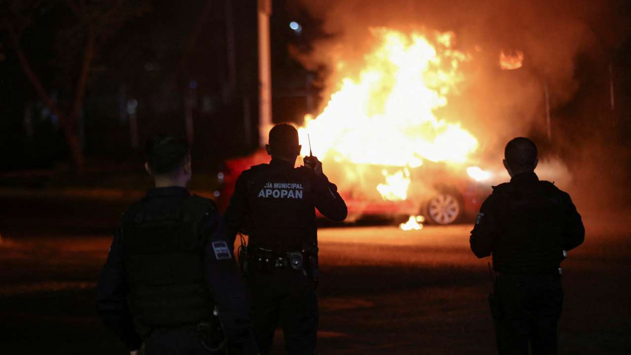 FILE PHOTO: Members of the Jalisco New Generation Cartel (CJNG) burn vehicles in Zapopan