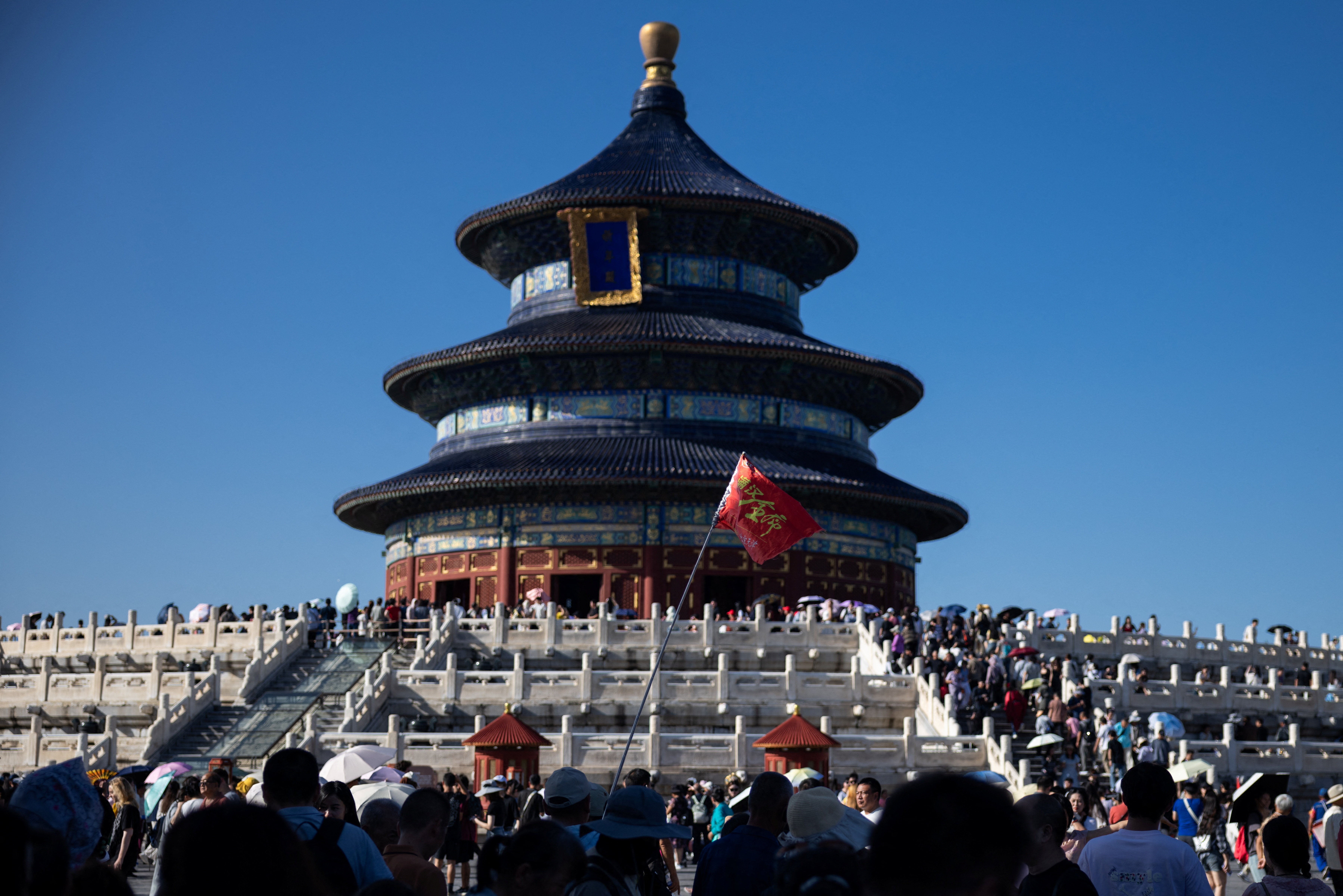 Tourists gather at the square surrounding Hall of Prayer for Good Harvests at the Temple of Heaven, or Tiantan Park, in Beijing