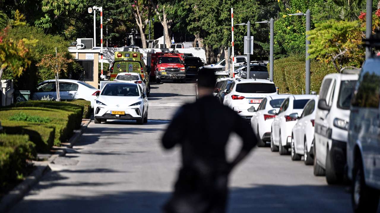 A member of Israeli security personnel stands at the entrance to a street, following a drone attack from Lebanon towards Israel amid ongoing hostilities between Hezbollah and Israel, in Caesarea