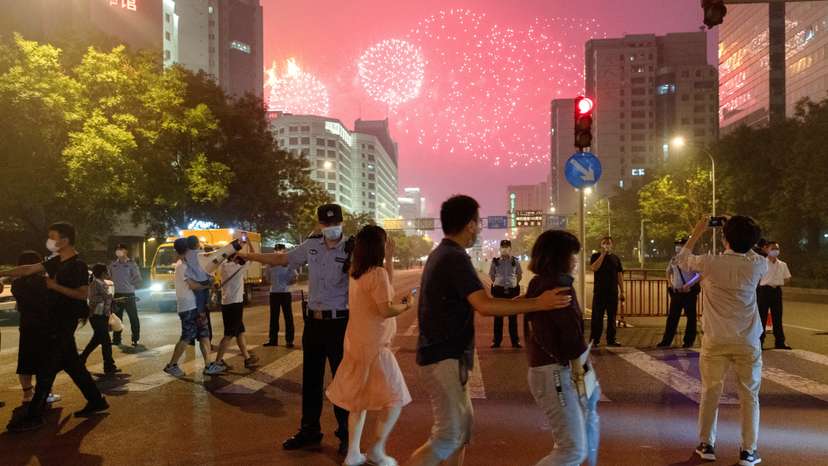 FILE PHOTO: FILE PHOTO: People watch a rehearsal of a fireworks display near the National Stadium ahead of the 100th founding anniversary of the Communist Party of China in Beijing