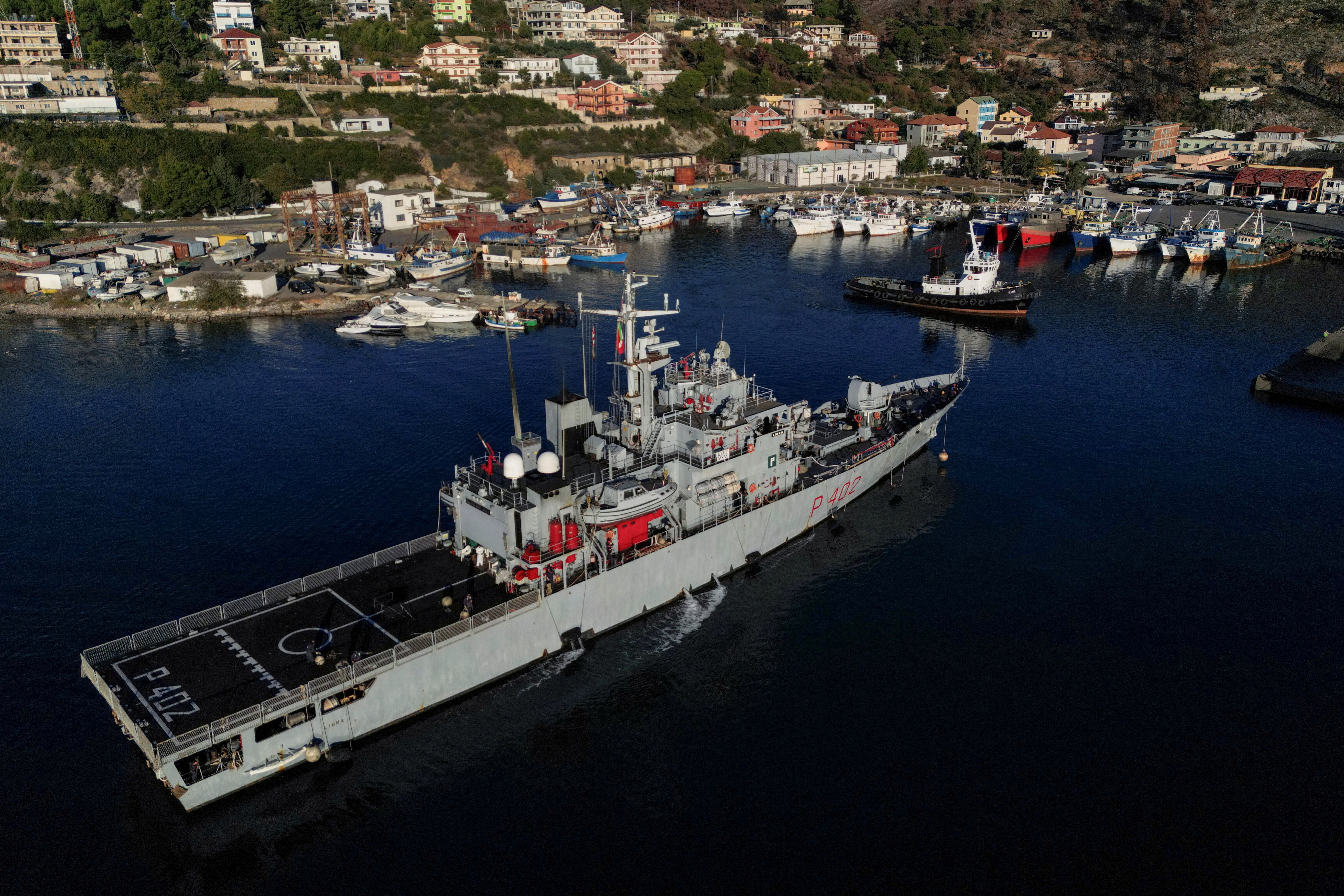 A drone view of the Italian navy ship Libra carrying migrants arriving in Shengjin