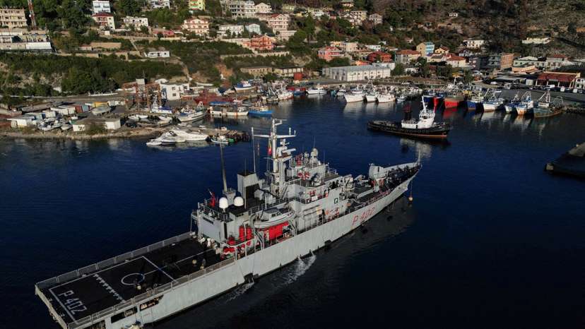 A drone view of the Italian navy ship Libra carrying migrants arriving in Shengjin