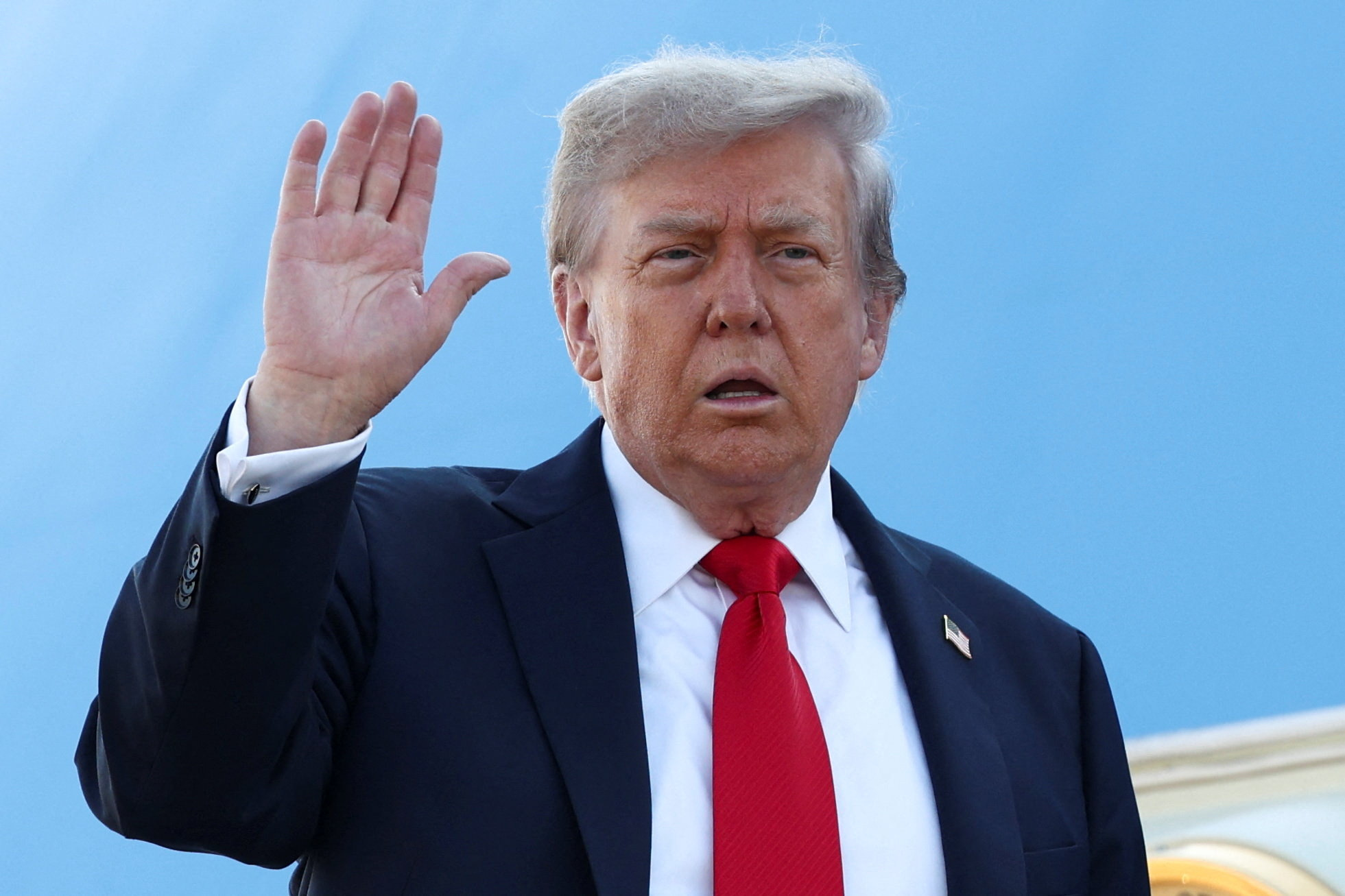 U.S. President Trump boards Air Force One as he departs for Alaska to meet with Russian President Putin