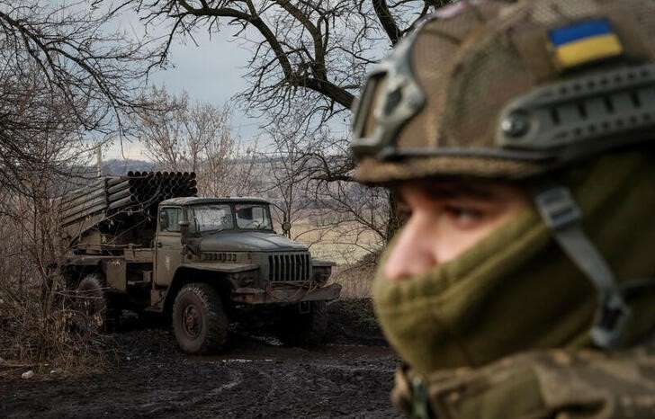 Ukrainian servicemen fire a BM-21 Grad multiple launch rocket system towards Russian troops in Donetsk region