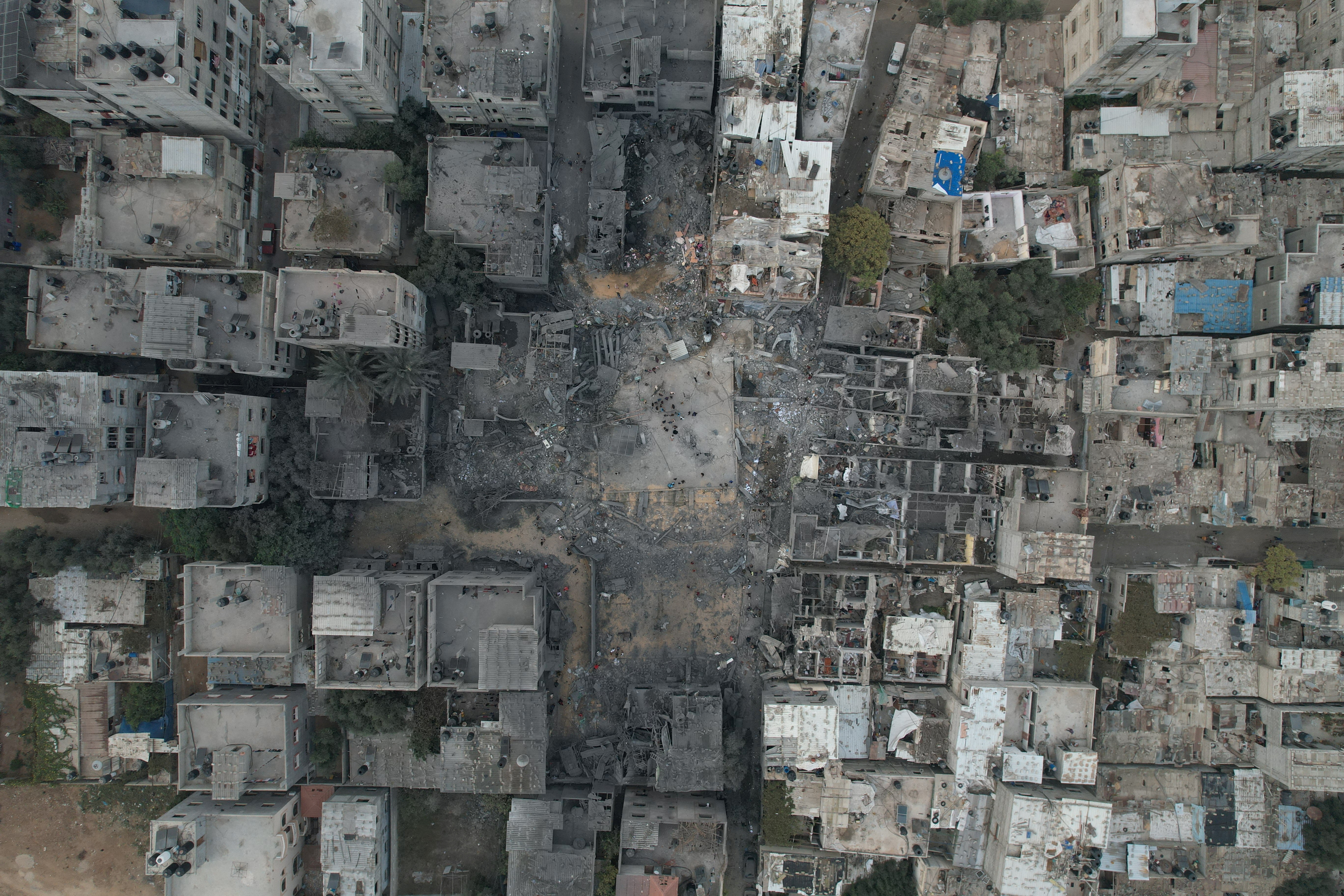 A view of the remains of a mosque and houses destroyed by Israeli strikes in the central Gaza Strip