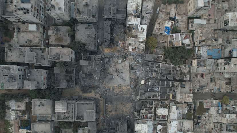 A view of the remains of a mosque and houses destroyed by Israeli strikes in the central Gaza Strip