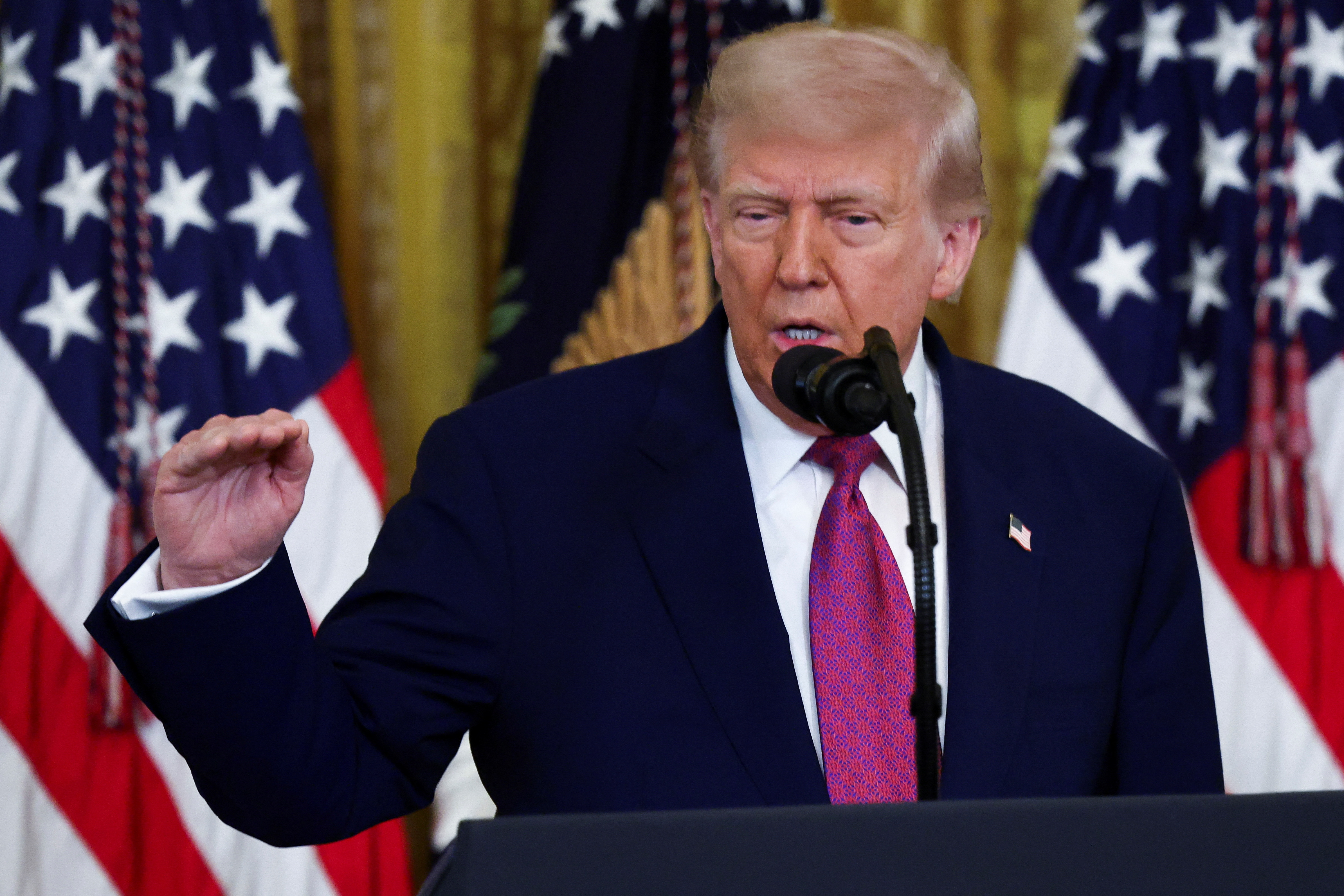U.S. President Trump signs a resolution at the White House