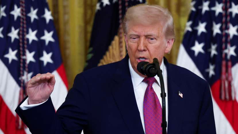 U.S. President Trump signs a resolution at the White House