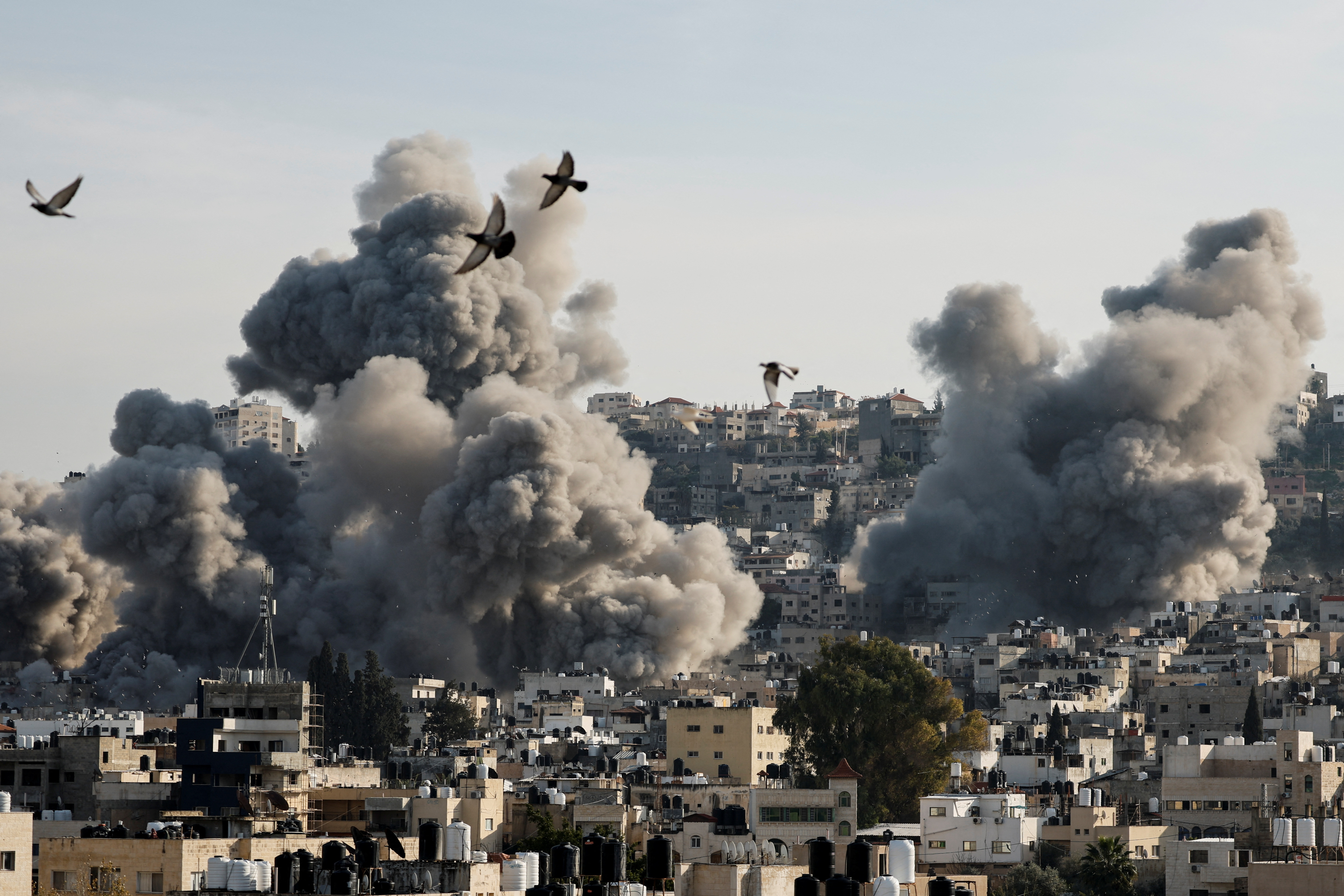 Smoke rises after an Israeli strike, in Jenin