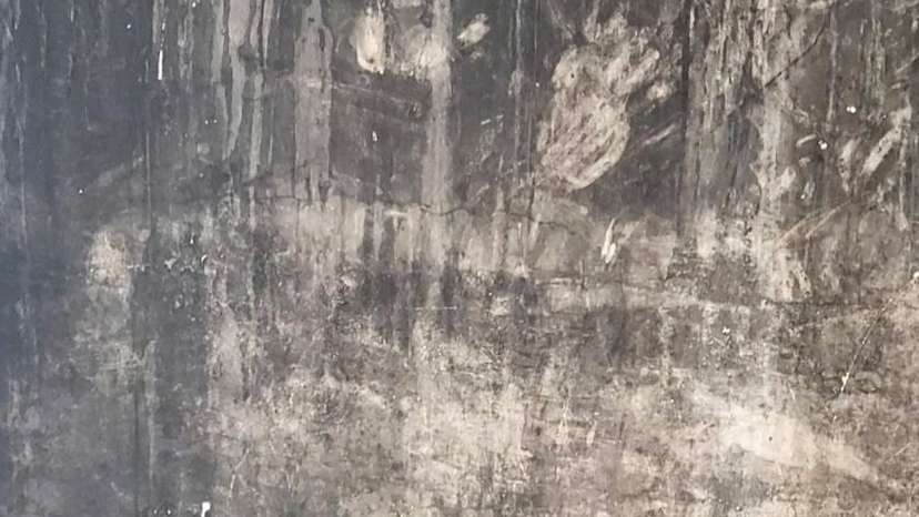 FILE PHOTO: Handprints on a blackened wall at Grenfell Tower, in London