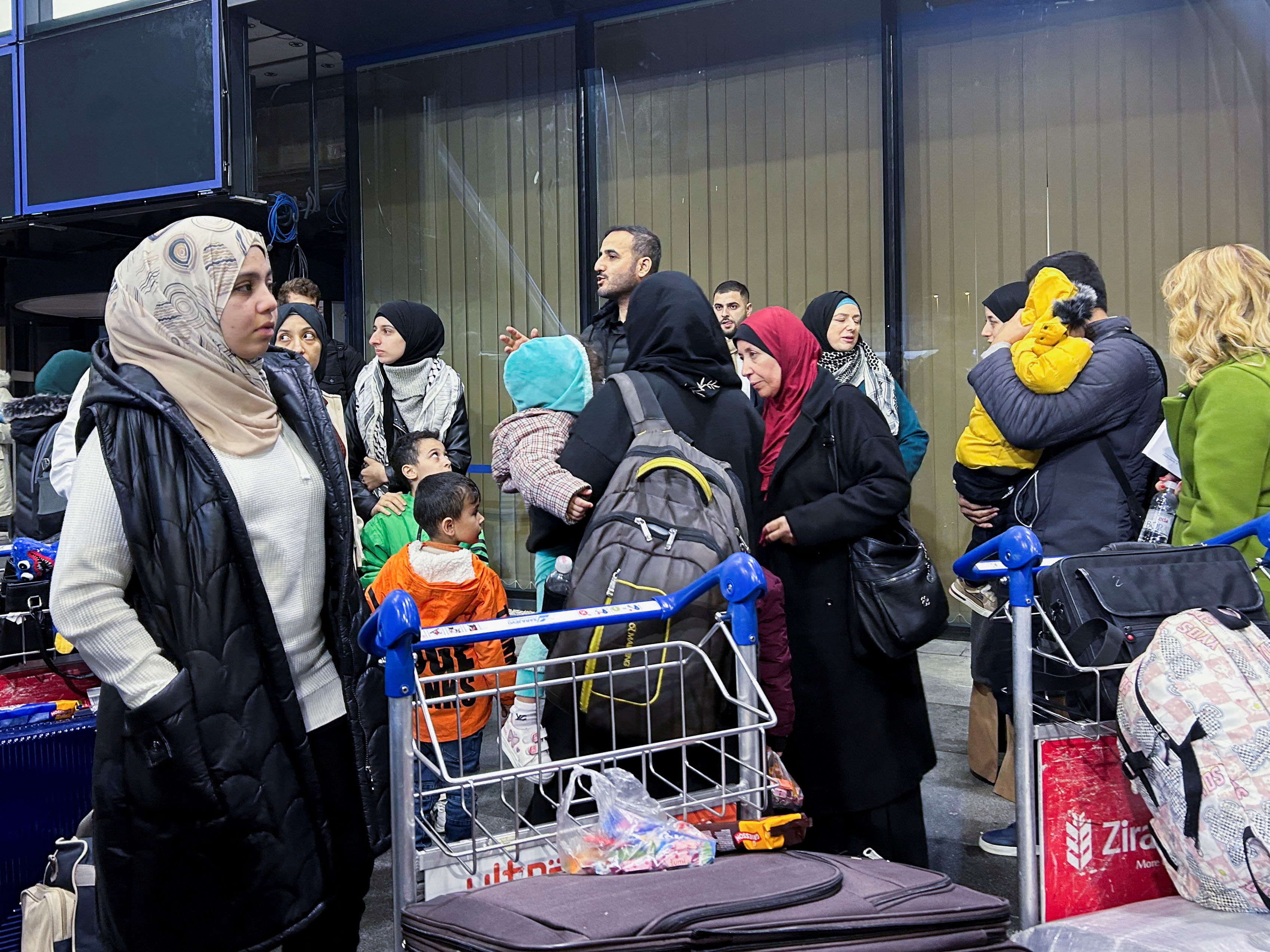 Palestinians holding Bosnian citizenship and their relatives arrive at Sarajevo after having been evacuated to Egypt from Gaza