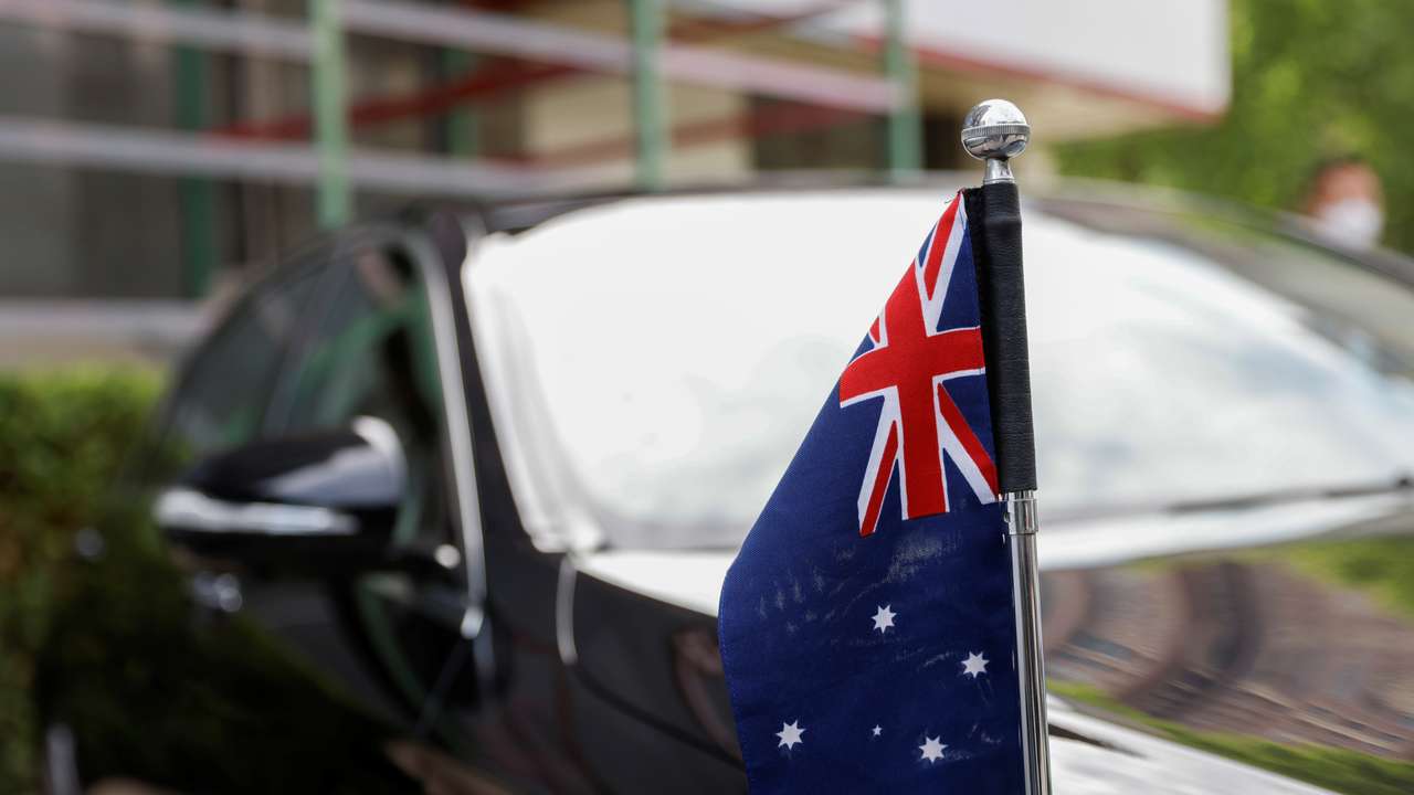 An Australian flag is seen on the car of Australia's Ambassador to China, Graham Fletcher, after he was not granted access to the Beijing No. 2 Intermediate People's Court, in Beijing